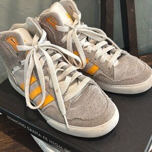 These are adidas high top sneakers. Been used but in great condition.